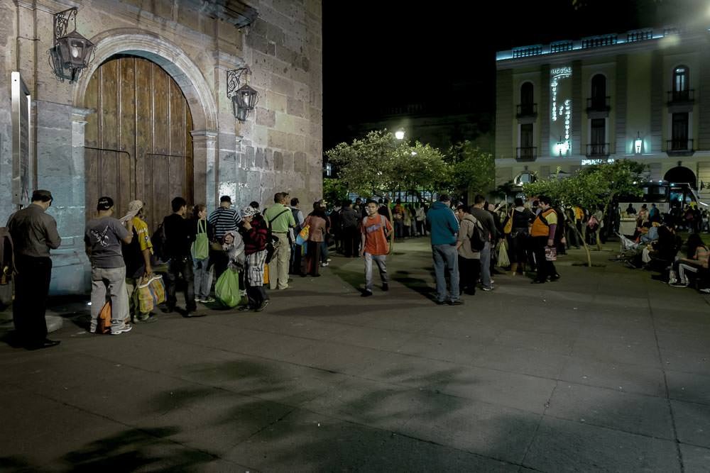 These people are queueing for the bus in a plaza in Guadalajara. First of all, that is a crazy long queue to have to wait in every day after work. Secondly, these must be the most orderly queues for public transport we have ever seen.