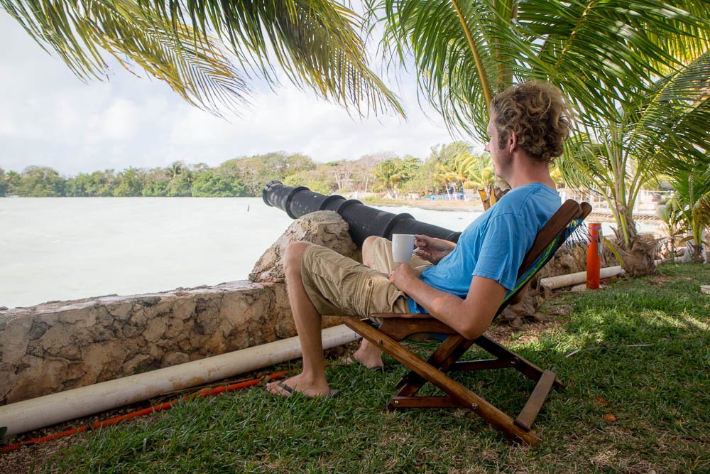 Ben enjoys a morning coffee stationed at the cannon overlooking the windy Caribbean.
